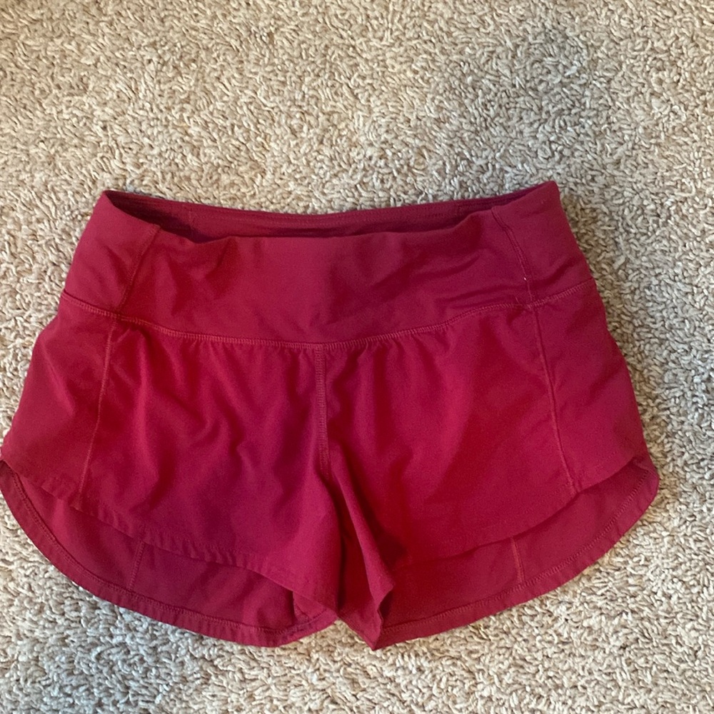 Red Lululemon speed up shorts 2.5 inches, size 2. GUC.